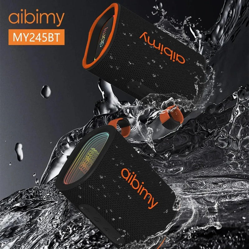 Parlante AIBIMY MY245BT con su correa naranja y luces RGB, vista en ángulo