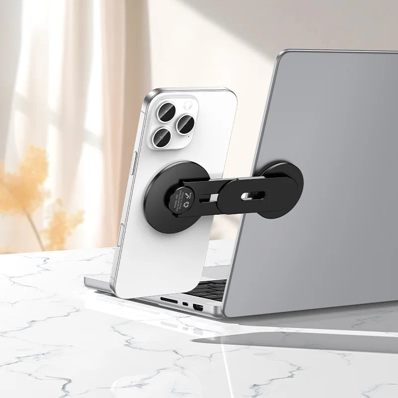 Soporte HOCO H93 montado en la tapa de un notebook