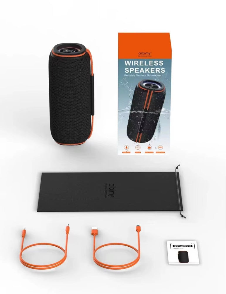 Dos parlantes AIBIMY MY272BTS con luces RGB encendidas junto a su packaging